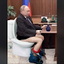 Bald guy squatting in the Dark